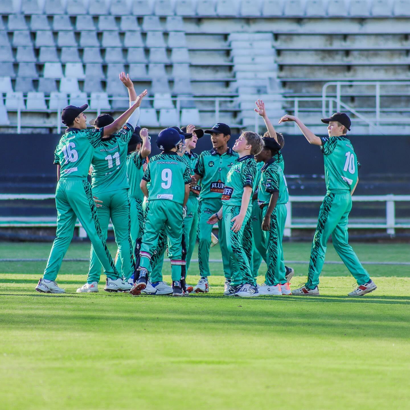Junior cricket team in custom branded kit
