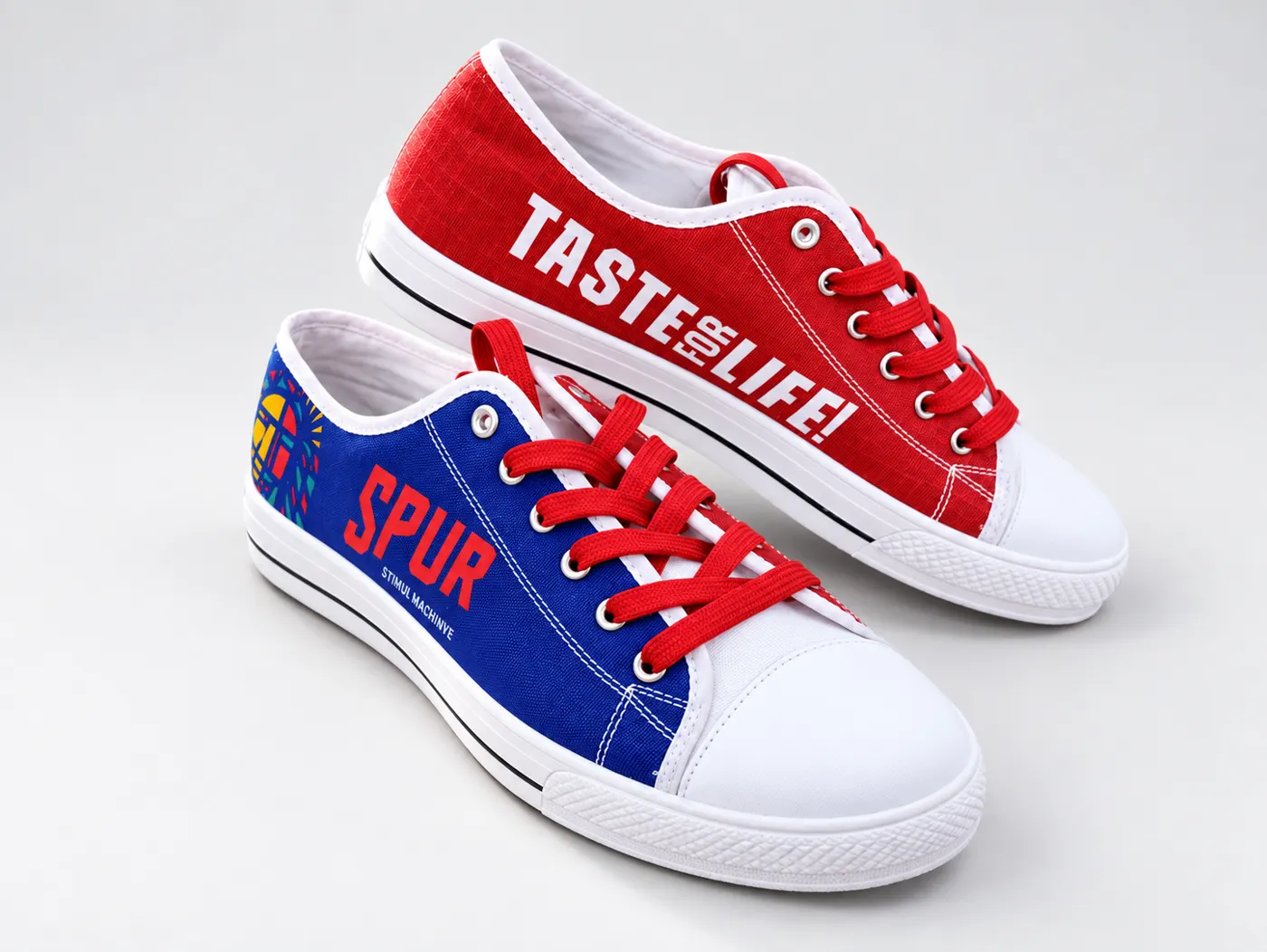 Custom Spur branded canvas sneakers in blue and red