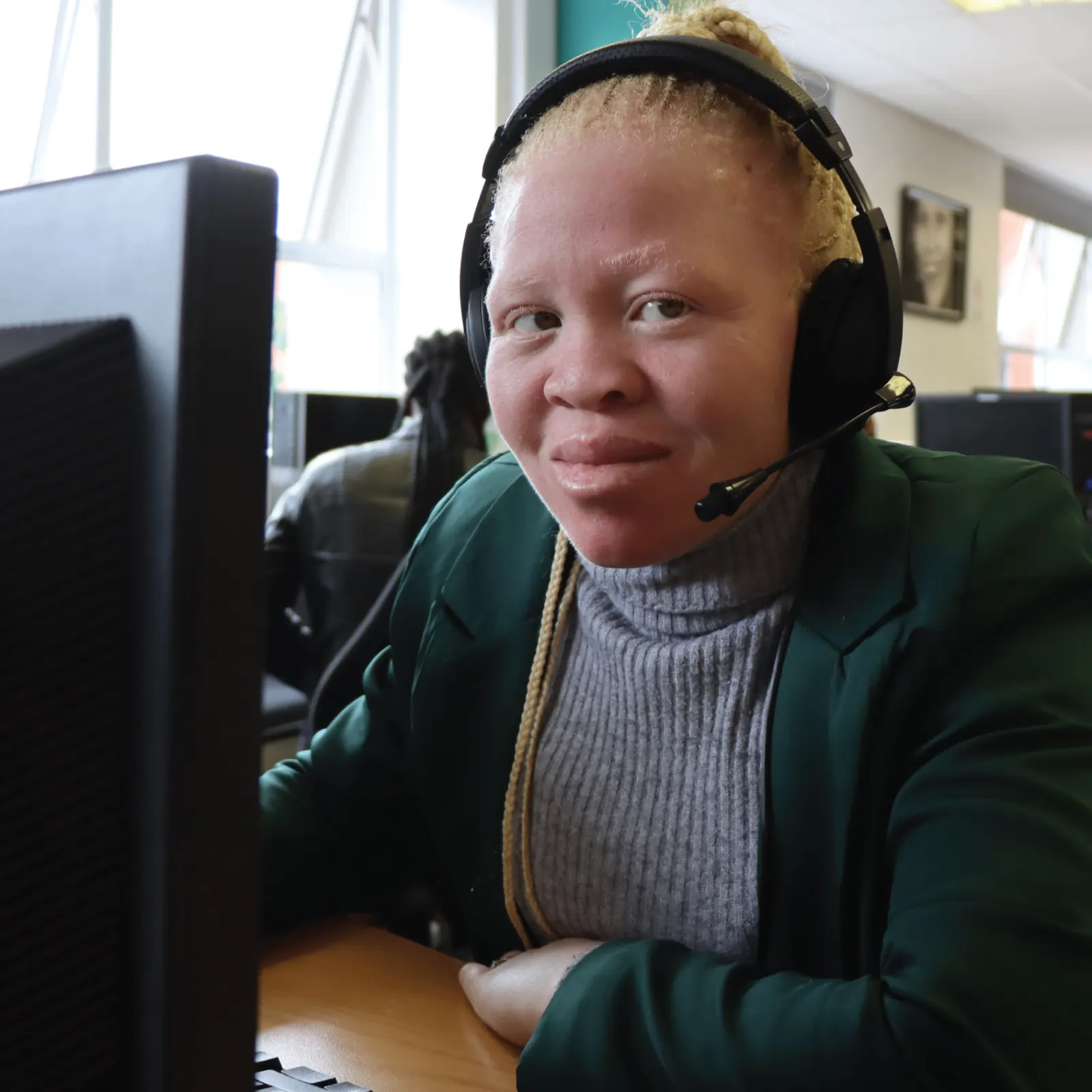 Learner participating in skills development at a computer workstation
